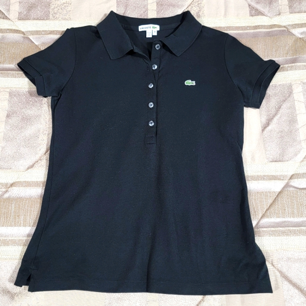 Ladies Lacoste Polo top. Pique knit. Very fitted. Size 38.